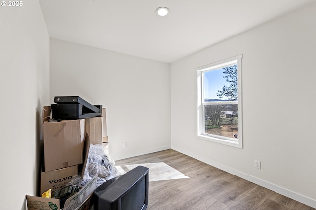 misc room with recessed lighting, baseboards, and wood finished floors