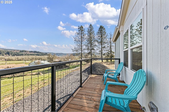 balcony featuring a rural view