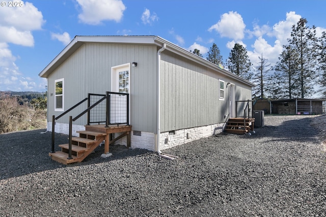 exterior space with crawl space and central air condition unit