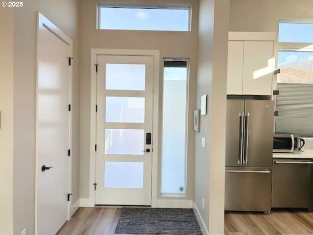 doorway to outside with light hardwood / wood-style flooring