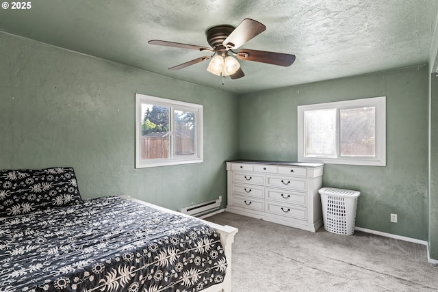 bedroom with ceiling fan, light carpet, a textured ceiling, and baseboard heating