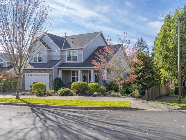 2600 Umpqua Ln, West Linn, OR 97068 - craftsman inspired home featuring stone siding, an attached garage, concrete driveway, and roof with shingles