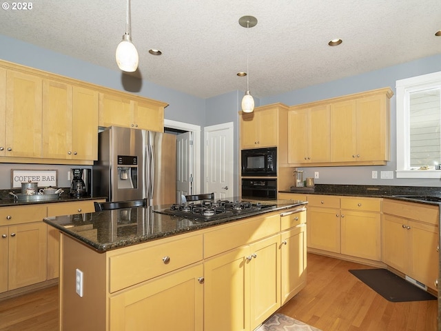 2600 Umpqua Ln, West Linn, OR 97068 - kitchen with black appliances, light brown cabinetry, light wood-style flooring, a sink, and a textured ceiling