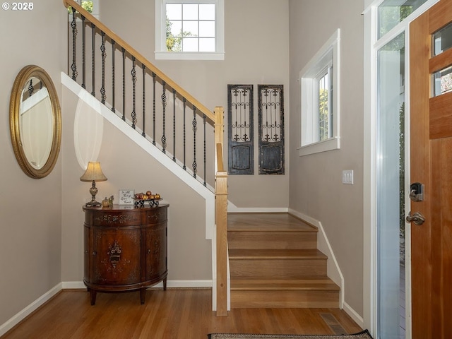 2600 Umpqua Ln, West Linn, OR 97068 - foyer featuring wood finished floors, stairs, baseboards, and a towering ceiling