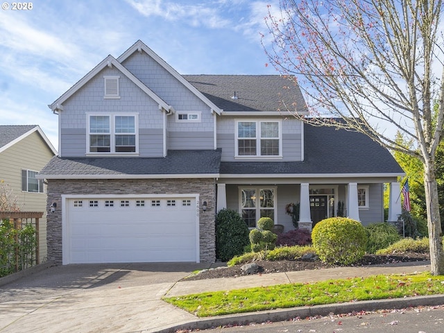 2600 Umpqua Ln, West Linn, OR 97068 - craftsman inspired home with concrete driveway, stone siding, an attached garage, and roof with shingles