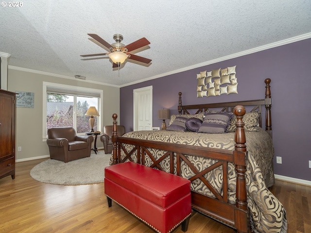 2600 Umpqua Ln, West Linn, OR 97068 - bedroom with wood finished floors, a textured ceiling, crown molding, baseboards, and ceiling fan