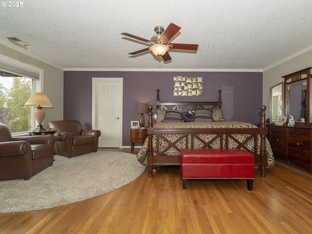 2600 Umpqua Ln, West Linn, OR 97068 - bedroom with wood finished floors, a textured ceiling, crown molding, and ceiling fan