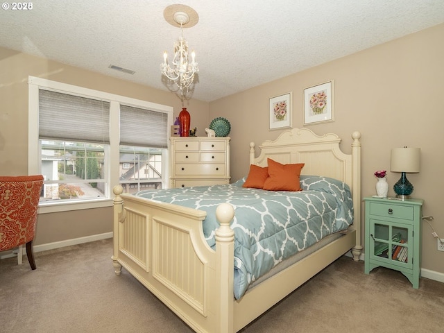 2600 Umpqua Ln, West Linn, OR 97068 - bedroom with light carpet, baseboards, a chandelier, and a textured ceiling