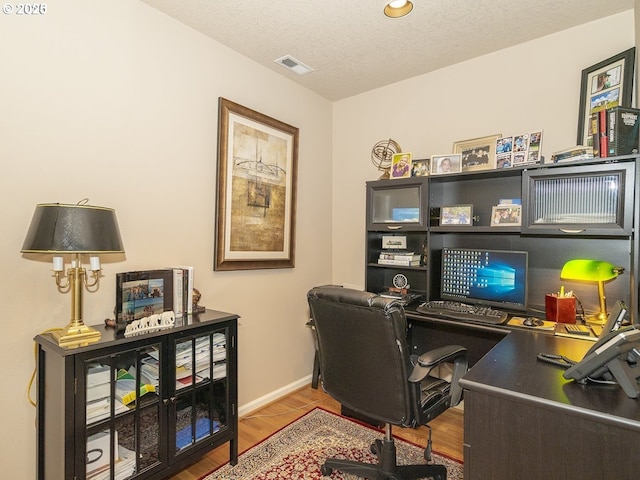 2600 Umpqua Ln, West Linn, OR 97068 - home office with wood finished floors, baseboards, and a textured ceiling