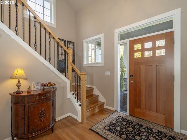 2600 Umpqua Ln, West Linn, OR 97068 - foyer entrance featuring wood finished floors, stairs, baseboards, and a towering ceiling