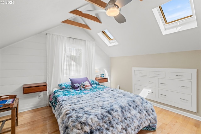 3416 SE 63rd Ave, Portland, OR 97206 - bedroom with a skylight, light wood-style flooring, and ceiling fan