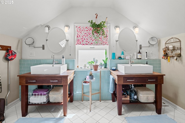 3416 SE 63rd Ave, Portland, OR 97206 - bathroom with tile walls, vaulted ceiling, tile patterned flooring, two vanities, and wainscoting