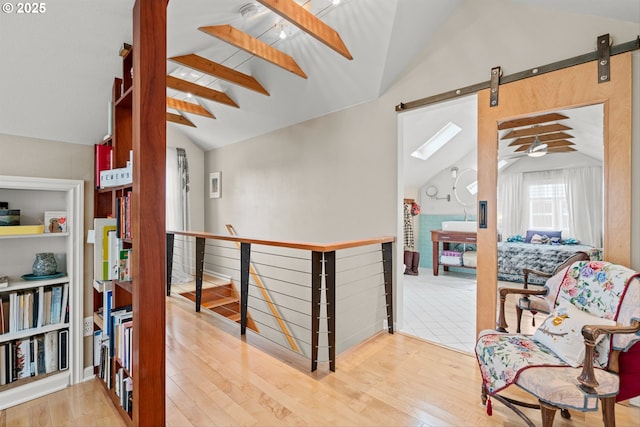 3416 SE 63rd Ave, Portland, OR 97206 - hall featuring wood finished floors, an upstairs landing, and a barn door