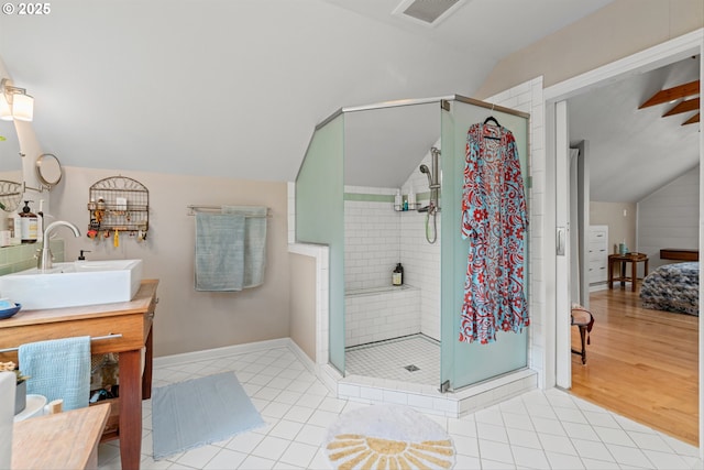 3416 SE 63rd Ave, Portland, OR 97206 - bathroom with lofted ceiling, vanity, a shower stall, tile patterned floors, and baseboards
