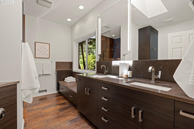 1911 NW Norfolk Ct, Portland, OR 97229 - bathroom featuring double vanity, wood finished floors, a skylight, backsplash, and a shower
