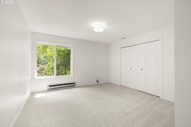 1911 NW Norfolk Ct, Portland, OR 97229 - unfurnished bedroom featuring baseboard heating, carpet flooring, and a closet