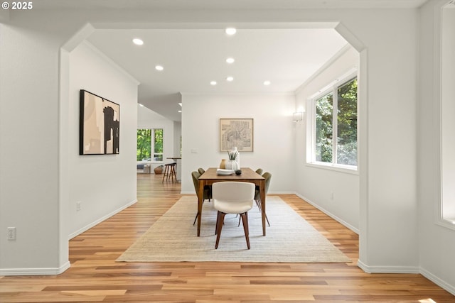 1911 NW Norfolk Ct, Portland, OR 97229 - dining room with light wood-type flooring, recessed lighting, arched walkways, and crown molding
