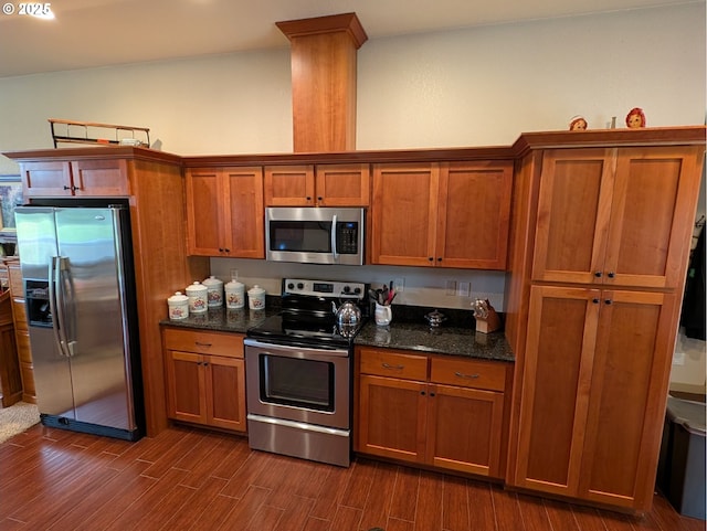 264 Mattie K Ln, Roseburg, OR 97471 - kitchen with stainless steel appliances, brown cabinets, dark wood finished floors, and dark stone counters