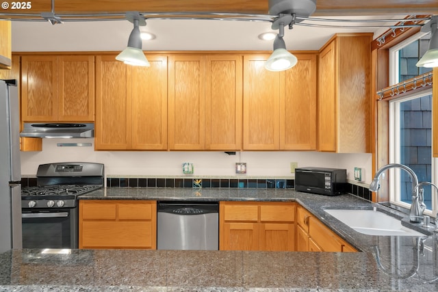 1710 Norkenzie Rd, Eugene, OR 97401 - kitchen featuring stainless steel appliances, extractor fan, a sink, dark stone counters, and a ceiling fan