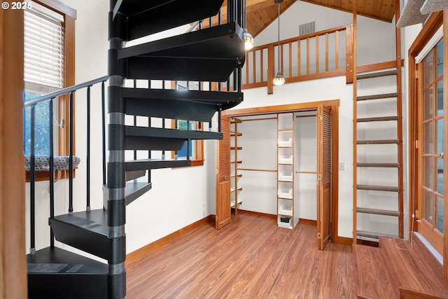 1710 Norkenzie Rd, Eugene, OR 97401 - unfurnished bedroom with wood finished floors, baseboards, and vaulted ceiling
