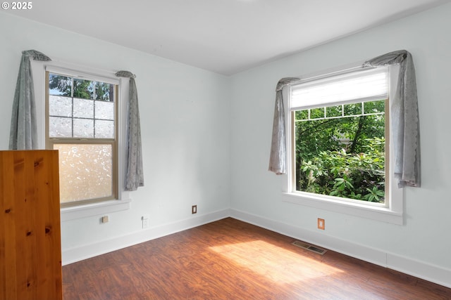 1710 Norkenzie Rd, Eugene, OR 97401 - empty room with plenty of natural light, wood finished floors, and baseboards