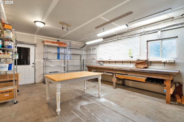 1710 Norkenzie Rd, Eugene, OR 97401 - miscellaneous room featuring a workshop area and unfinished concrete flooring
