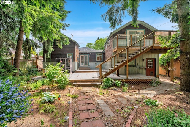 1710 Norkenzie Rd, Eugene, OR 97401 - rear view of house with a wooden deck and stairs