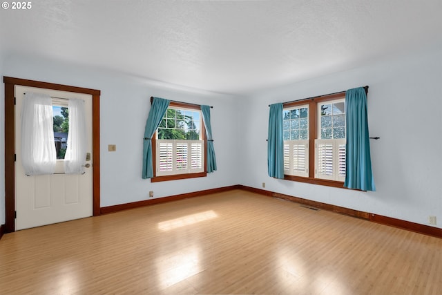 1710 Norkenzie Rd, Eugene, OR 97401 - entryway with wood finished floors and baseboards