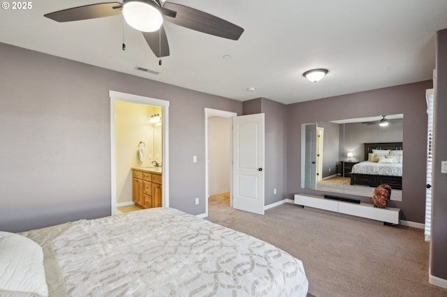 229 N 33rd Ct, Ridgefield, WA 98642 - bedroom featuring light carpet, baseboards, ensuite bath, and a ceiling fan
