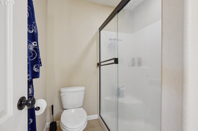229 N 33rd Ct, Ridgefield, WA 98642 - full bathroom featuring a shower stall, baseboards, and toilet