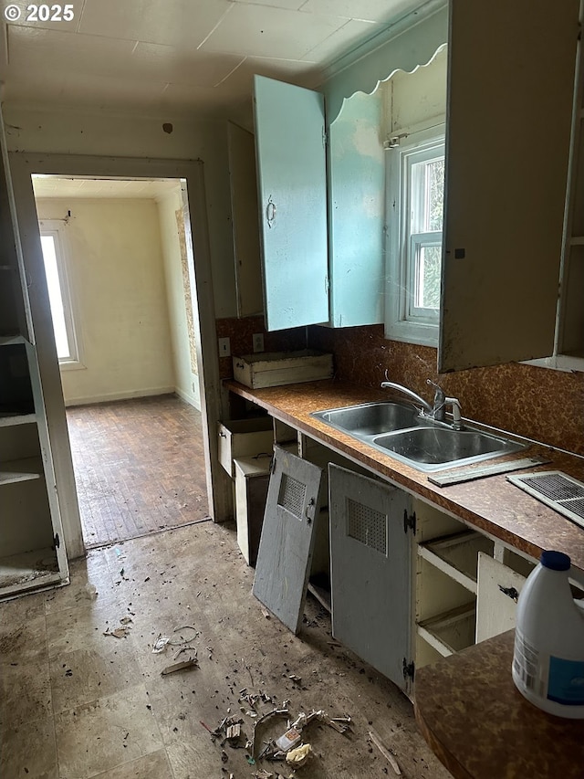 kitchen with a sink and backsplash