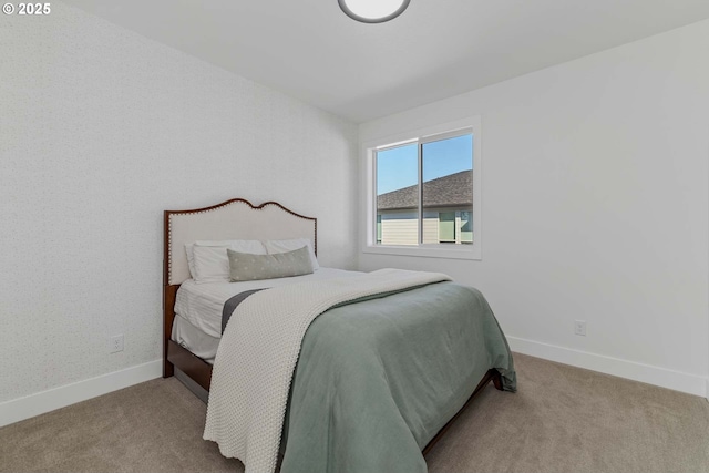 bedroom with carpet flooring and baseboards