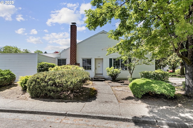 6095 SW Erickson Ave, Beaverton, OR 97008 - view of front facade featuring a chimney