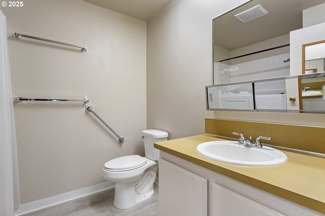 6095 SW Erickson Ave, Beaverton, OR 97008 - bathroom with toilet, wood finished floors, baseboards, and vanity