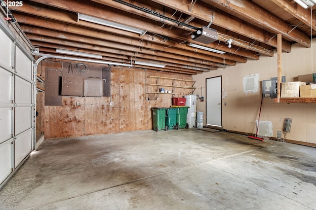 6095 SW Erickson Ave, Beaverton, OR 97008 - garage featuring a garage door opener and strapped water heater