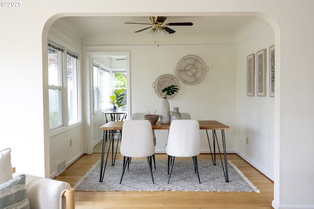 2416 SE 60th Ave, Portland, OR 97206 - dining space with arched walkways, wood finished floors, and a ceiling fan