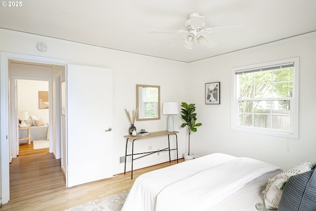 2416 SE 60th Ave, Portland, OR 97206 - bedroom featuring multiple windows, light wood-type flooring, and a ceiling fan