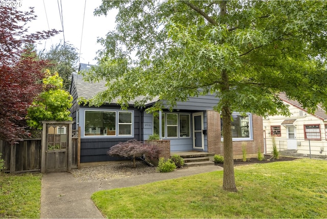 2416 SE 60th Ave, Portland, OR 97206 - obstructed view of property with a gate and brick siding