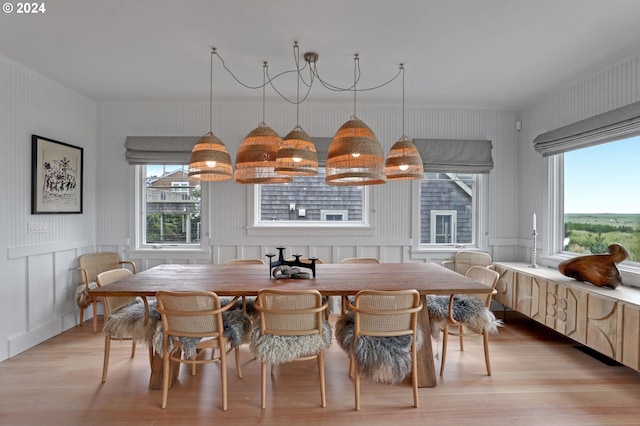 486 N Ocean Ave, Gearhart, OR 97138 - dining room featuring a decorative wall and light wood-style flooring