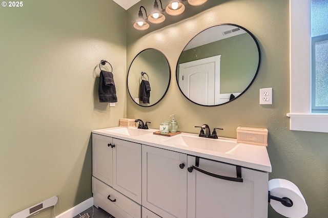 607 E Kennedy Ct, Carlton, OR 97111 - bathroom featuring double vanity and baseboards