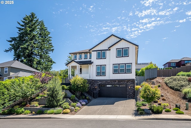840 Chikamin Loop, Silverton, OR 97381 - view of front of property featuring stairway, board and batten siding, concrete driveway, an attached garage, and stone siding