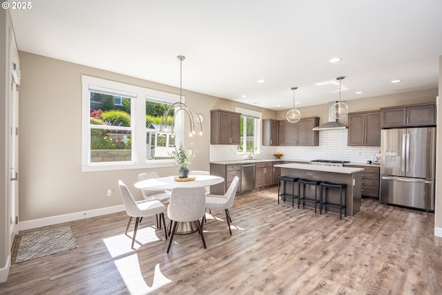840 Chikamin Loop, Silverton, OR 97381 - dining room featuring light wood finished floors, baseboards, and recessed lighting