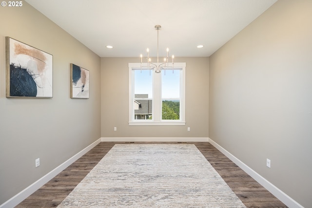 840 Chikamin Loop, Silverton, OR 97381 - spare room with a chandelier, dark wood-style flooring, baseboards, and recessed lighting