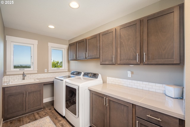 840 Chikamin Loop, Silverton, OR 97381 - laundry area with separate washer and dryer, cabinet space, dark wood-type flooring, and recessed lighting