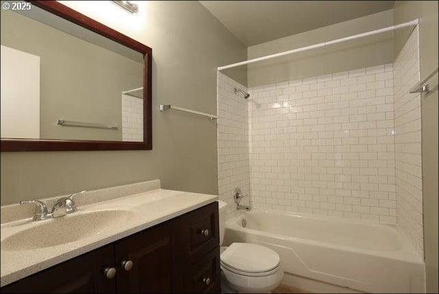 bathroom featuring toilet,  shower combination, and vanity