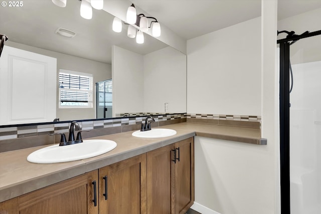 385 SW Mitchum Ter, Beaverton, OR 97006 - full bathroom with tasteful backsplash, double vanity, and a shower