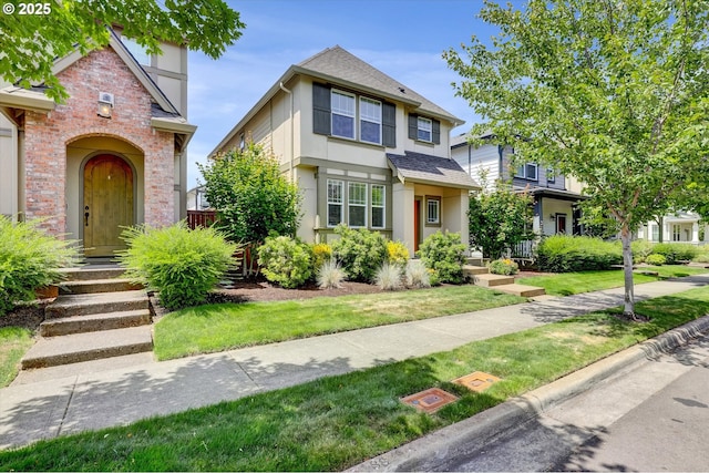 385 SW Mitchum Ter, Beaverton, OR 97006 - traditional-style house featuring stucco siding, a shingled roof, and a front yard