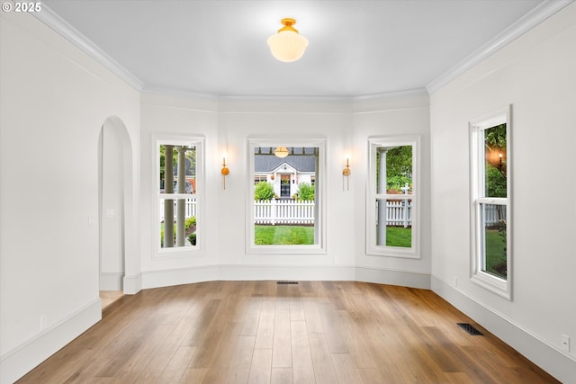 2089 5th Ave, West Linn, OR 97068 - unfurnished room with wood finished floors, arched walkways, and ornamental molding
