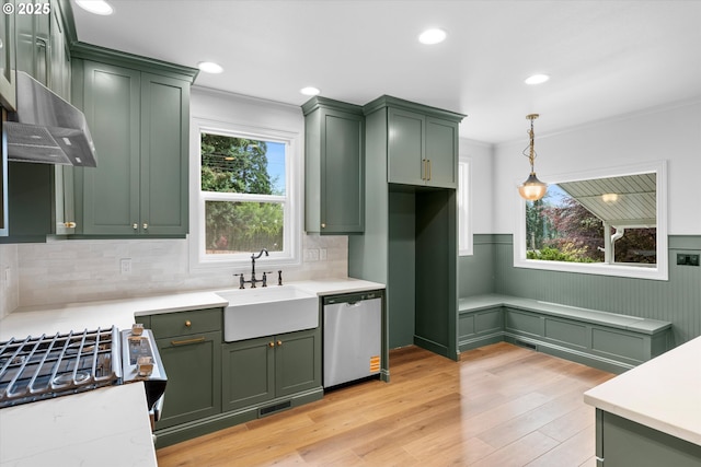 2089 5th Ave, West Linn, OR 97068 - kitchen featuring green cabinetry, stainless steel dishwasher, decorative light fixtures, recessed lighting, and ornamental molding
