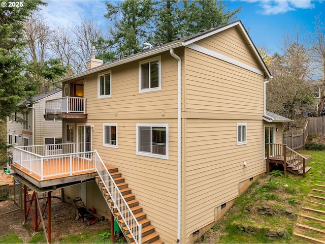 4216 SW Brugger St, Portland, OR 97219 - back of house featuring stairs, a balcony, a chimney, crawl space, and a wooden deck